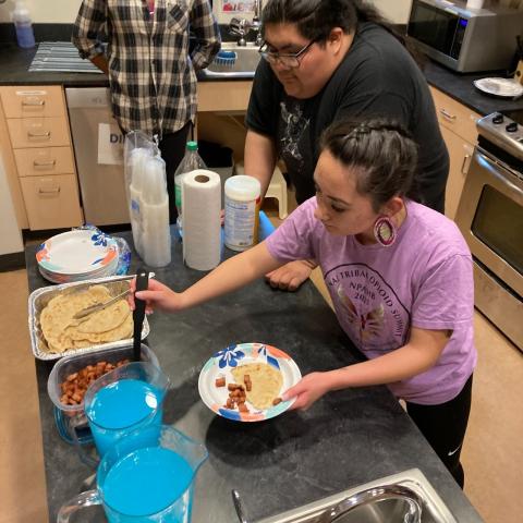 students cooking traditional foods