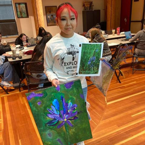 student holder painting and cookbook